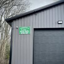 Legacy Line Auto building illuminated at night