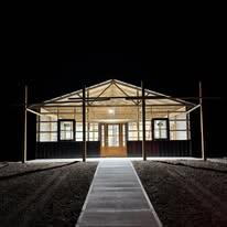 Service bay inside Legacy Line Auto with lift and tools